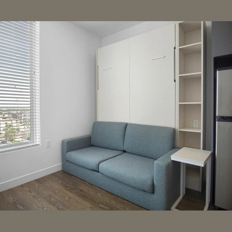 White Murphy bed cabinet closed in compact living room with sofa